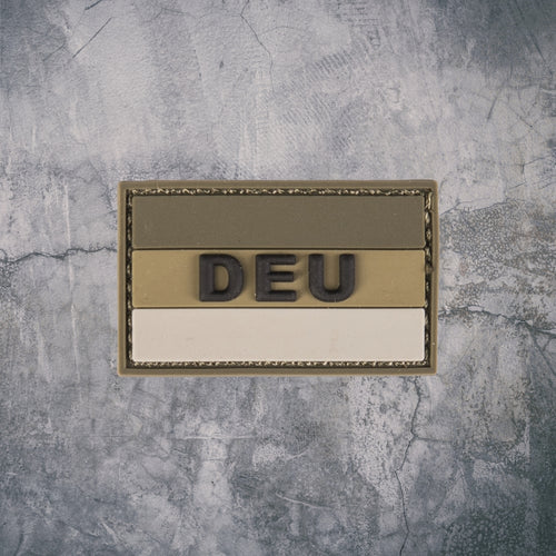 `Tactical DEU Patch in Beige und Braun vor grauem Hintergrund`
